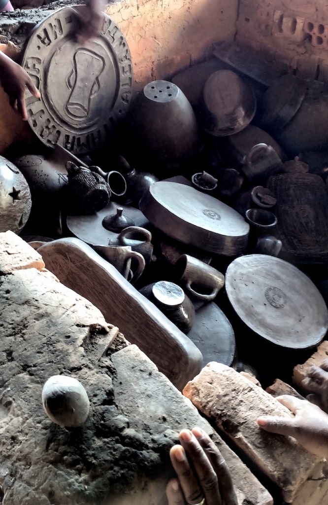 Setting the clay objects into the oven